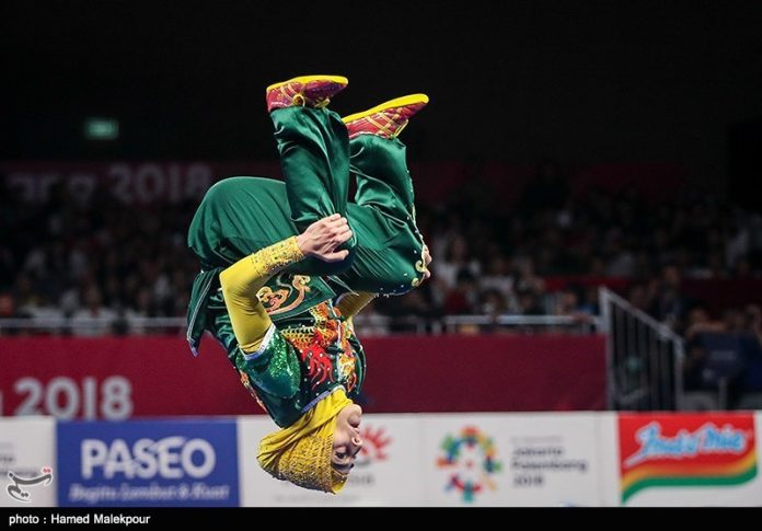 asiad-wushu-sanshou-2026 Vận động viên thi đấu wushu Tán thủ (Sanshou) tại một giải đấu quốc tế